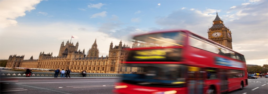 A London bus travelling past the Houses of Parliament