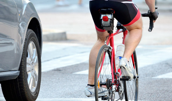 A road cyclist dodging traffic