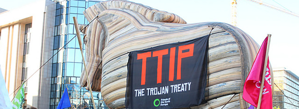 A trojan horse outside the European Parliament with banner 'TTIP the Trojan Treaty'